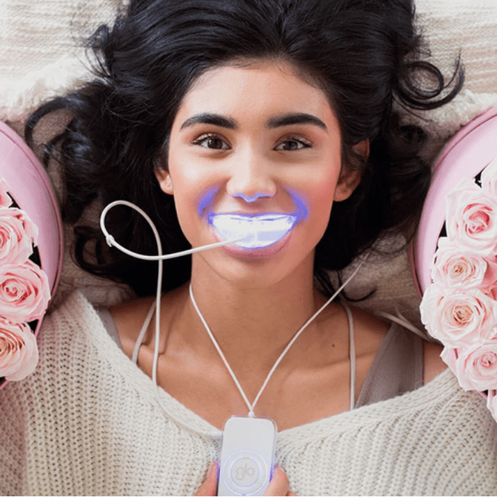 Woman Wearing Glo Teeth Whitening System